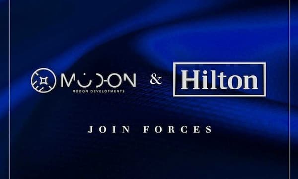 شعار هيلتون وشركة مدن العقارية.